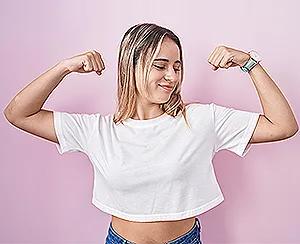 Female looking at her upper arm fat deposit